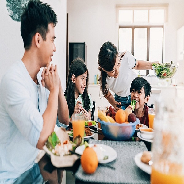 Happy Asian Ethnicity Family At The Table